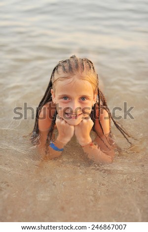 Adorable Little Girl In Splashing In Shallow Water Stock Photo ...