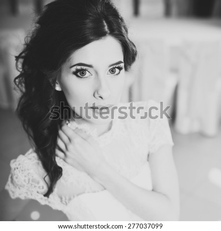 Happy bride posing. Wedding portrait of beautiful fiance in black and white.