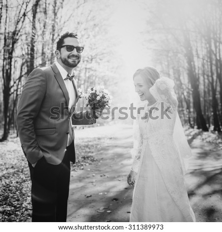 Young wedding couple in love together.  Newlyweds in black and white.
