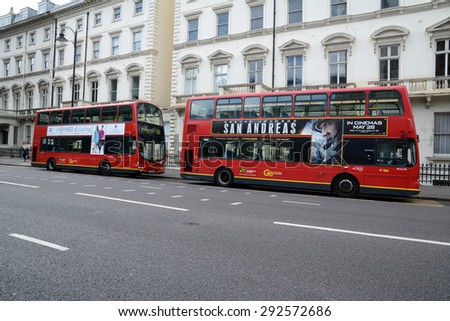 LONDON, UK - MAY 25, 2015: Two red double decker buses on Cromwell Road. The London Bus is one of London\'s principal icons.