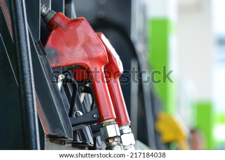 Petrol gas station pump and pumping gasoline fuel
