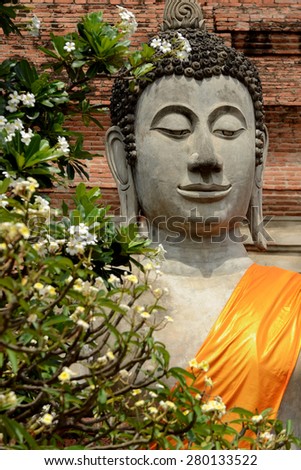 Picture from world heritage Ayutthaya site, Buddha meditating statue at Wat Yai Chaimongkol temple Ayutthaya, Thailand