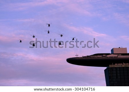 Singapore August, 1 2015: Chinook and Apaches Helicopter fly on sky for Fiftieth anniversary of Singapore 50 years National Day Golden Jubilee over Marina Bay Sands Hotel (Real day is Aug 9, 2015)