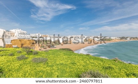 Similar – Image, Stock Photo Wide sandy Faro beach with dunes and walkways by the sunset, Algarve, Portugal