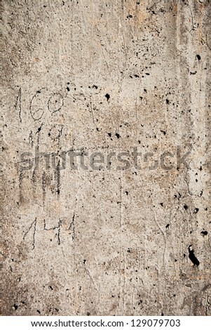 Concrete column texture with pencil notes on it