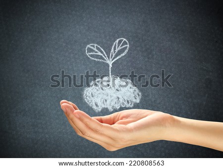 Doodle plant on human hand. Ecology concept.