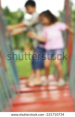 Blurred Children play in play ground activity.Blurred activity background.