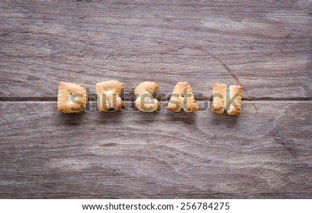 Dream text with cookies and blank space on the wooden background