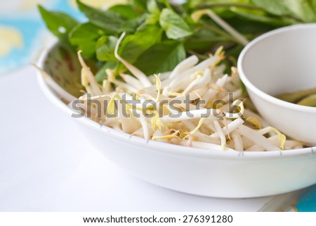 Mung beans or bean sprouts on white plates.