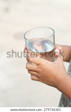 Hand holding Glass of water, glass of drink water.