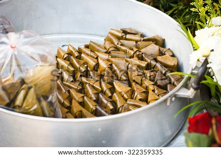 Thai traditional sticky rice dessert in banana leaf packaging sell in Thailand market. Khow Thom Mud.