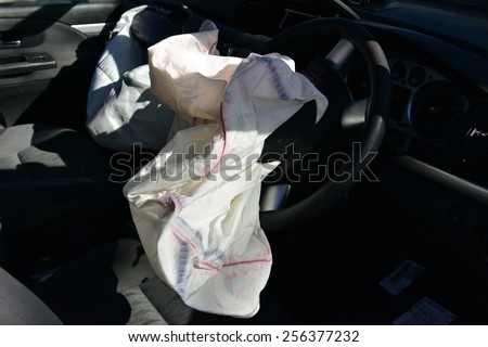 An exploded drivers air bag in a car accident