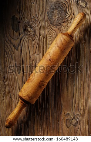 vintage rolling pin on wooden background