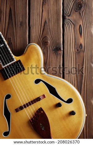 hollow body jazz guitar on aged wood