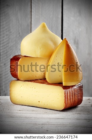 assorted spanish artisan cheese on grey wooden background