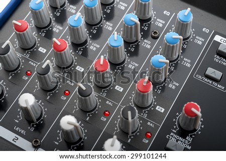 knobs board of a home studio mixing console