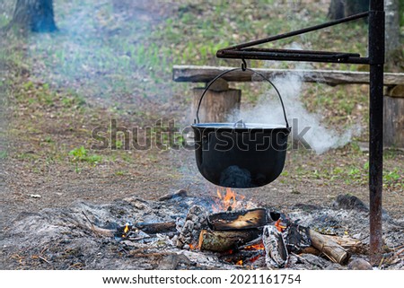 Similar – Image, Stock Photo Kettle placed on campfires in snowy woods at sundown