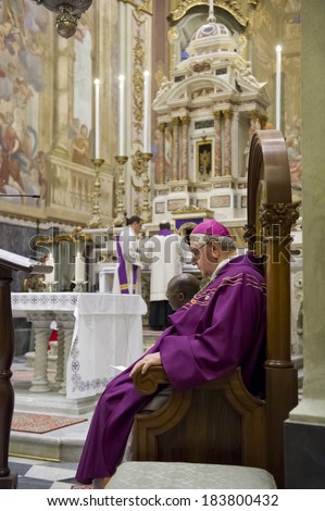 GENOA, ITALY - MARCH 22, 2014: Bishop and priest officiating Mass for confirmation in the Church of Santa Maria dell\'Assunta in Sestri Ponente, Genoa, Italy.