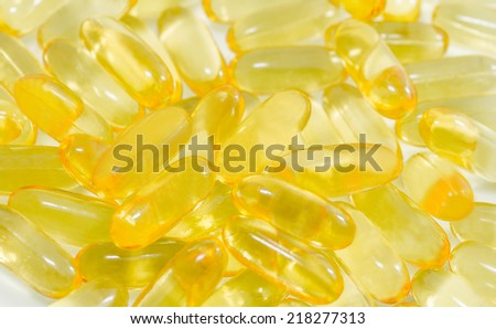 Fish oil food supplements macro closeup background