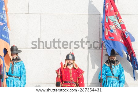 Seoul, South Korea - December 31,2014 : Unknown men in ancient Korean soldier costume around Gyeongbokgung palace  for tourist attraction  in Seoul, South Korea