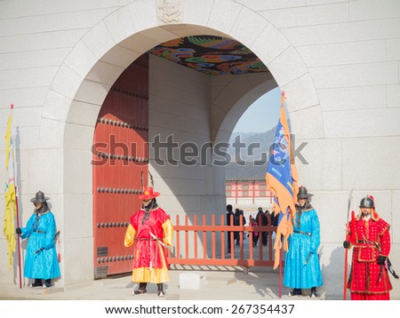 Seoul, Republic of Korea - December 31,2014 : Unknown men in ancient Korean soldier costume around Gyeongbokgung palace  for tourist attraction  in Seoul, South Korea