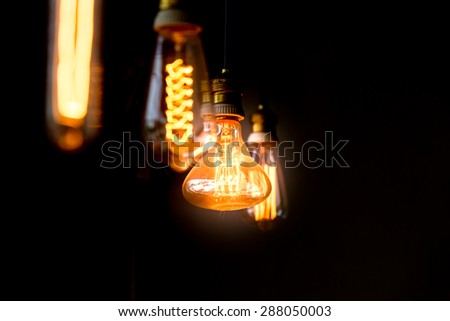 Hanged  orange decoration light bulbs focus on pear shape like  one  in the dark  room one  in the dark  room