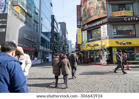 Seoul, Republic of Korea - December 31, 2014 : Unknown People walking around Myeongdong ,famous shopping street in Seoul capital of South Korea