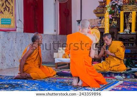 BANGKOK,THAILAND December 4: Newly ordained Buddhist monk pray with priest procession. Newly ordained Buddhist monks have a ritual in the temple procession in December 4, 2014