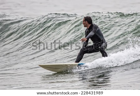 Man surfing a wave in the sea