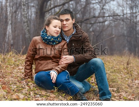 Love story pictures of beautiful couple in autumn forest