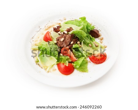 Salad from meat, cheese, tomato, pinienkernen and salad leafs on white background