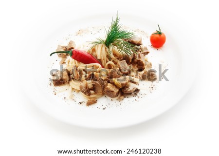 Noodles with meat pieces and vegetables on white background
