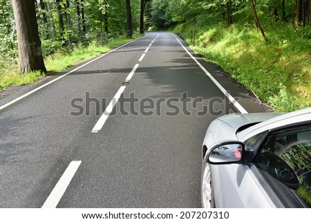 Car ride on road in sunny weather. Road in the countryside with trees