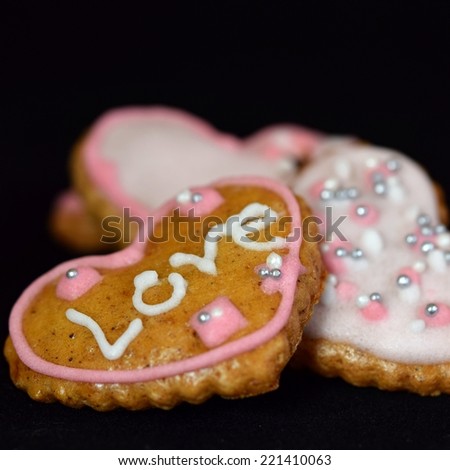 Gingerbread cookies. Decorated home baked gingerbread cookies with colored icing sugar.  Ready for Christmas or Valentine\'s Day