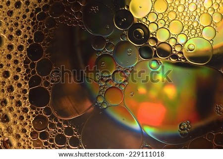 Abstraction, oil colorful bubbles in water.