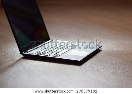 Technology and  business concept. Clean wooden background. Laptop computer.