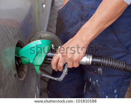 Man, filling the car tank with fuel