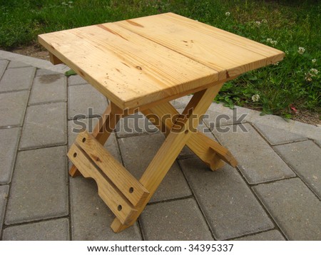 Small wooden folding camp stool, close up