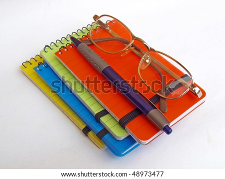 The set of four different color notebooks