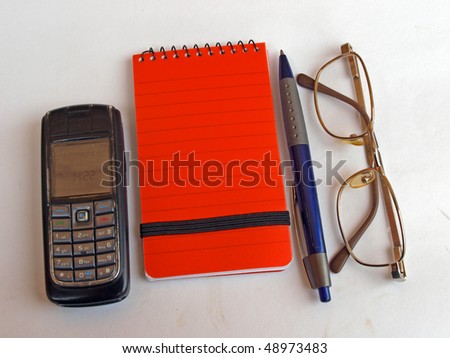 Old people set - mobile phone, notebook, pen, glasses