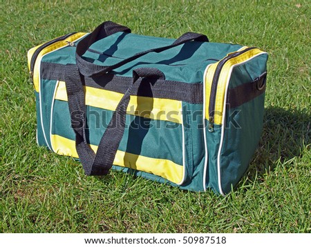 Simple cheap green bag on the grass
