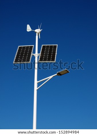 Street lamp powered by solar panels and wind turbine