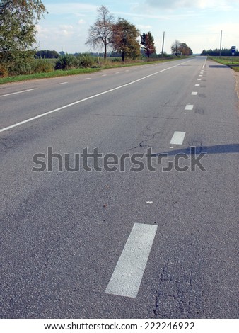 Asphalt road with marker lines in rural district