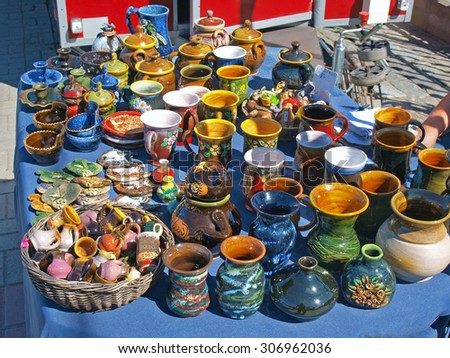 LIEPAJA, LATVIA - AUGUST 16, 2015: Handmade ceramic kitchenware in latvian national style is for sale on town central market.