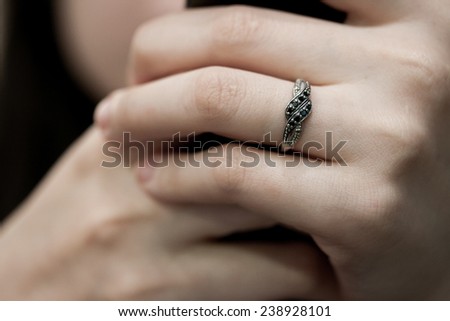 Black diamond ring on lady\'s finger