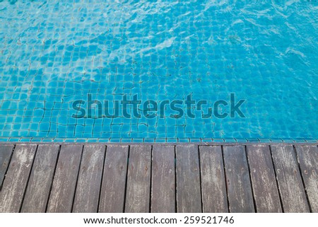 Swimming pool and wooden deck background