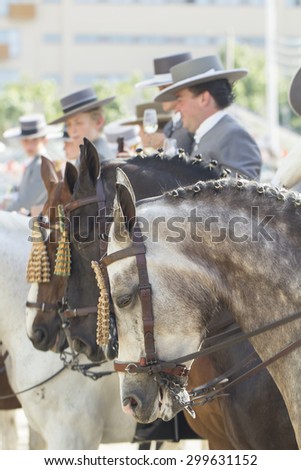 SEVILLE, SPAIN - APR, 25:people in traditional costume with horses at the Seville\'s April Fair on April, 25, 2014 in Seville, Spain