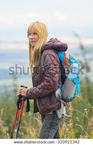 woman with hiking sticks