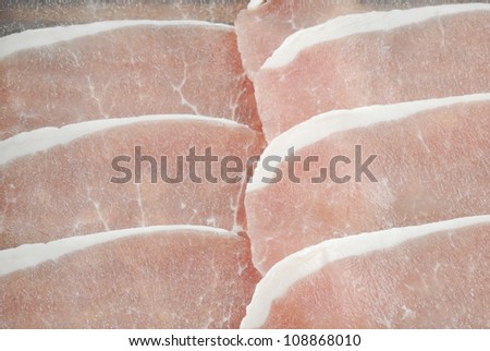 Rashers of bacon isolated on a white studio background.