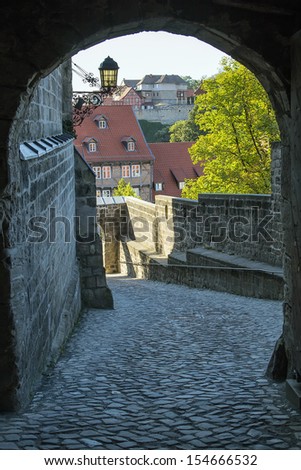 Castle in Quedlinburg settles down on the mountain and towers over the city, Germany. Gate in the castle